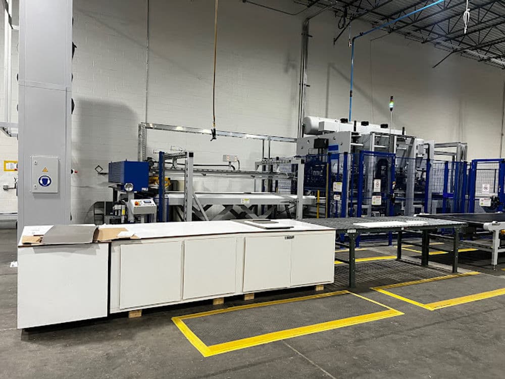 Modern industrial workspace with machinery and equipment for manufacturing processes.